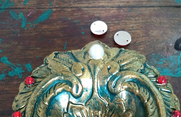 Painting diya lamps, to bring light and solidarity 1